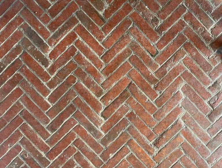 Old brick herringbone pattern floor